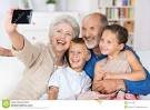 grandparents taking pictures of grandchildren