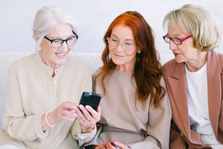 Three senior women talking about empty nest syndrome
