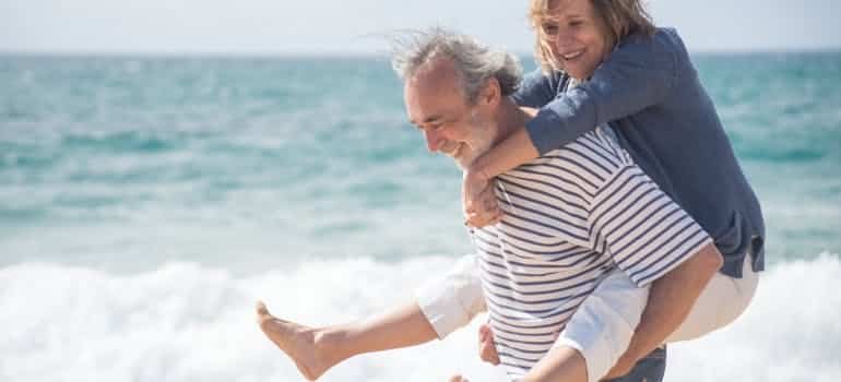 an elderly couple at the beach