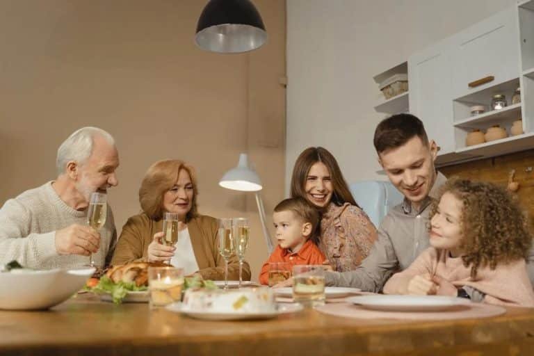 A multi-generational family eating together.